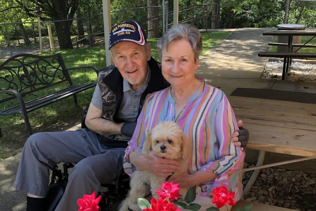 Castlewoods Place | Pat and husband in a flower garden