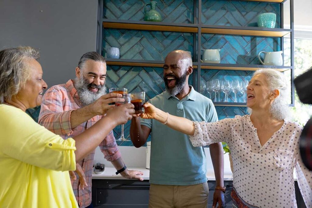 The Legacy at Cimarron in El Paso | Happy Seniors Toasting With A Drink